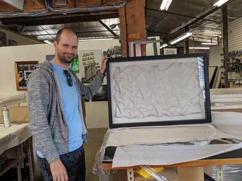 Tim Povall folding an origami tessellation